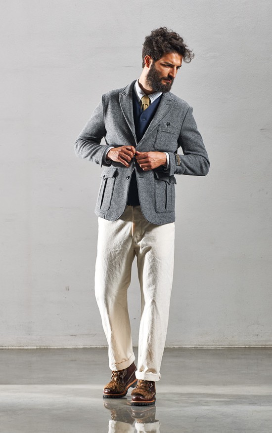 You can go all out. Layered cardigan, necktie, trousers and then soften the hard business look with a safari jacket and hiking boots.